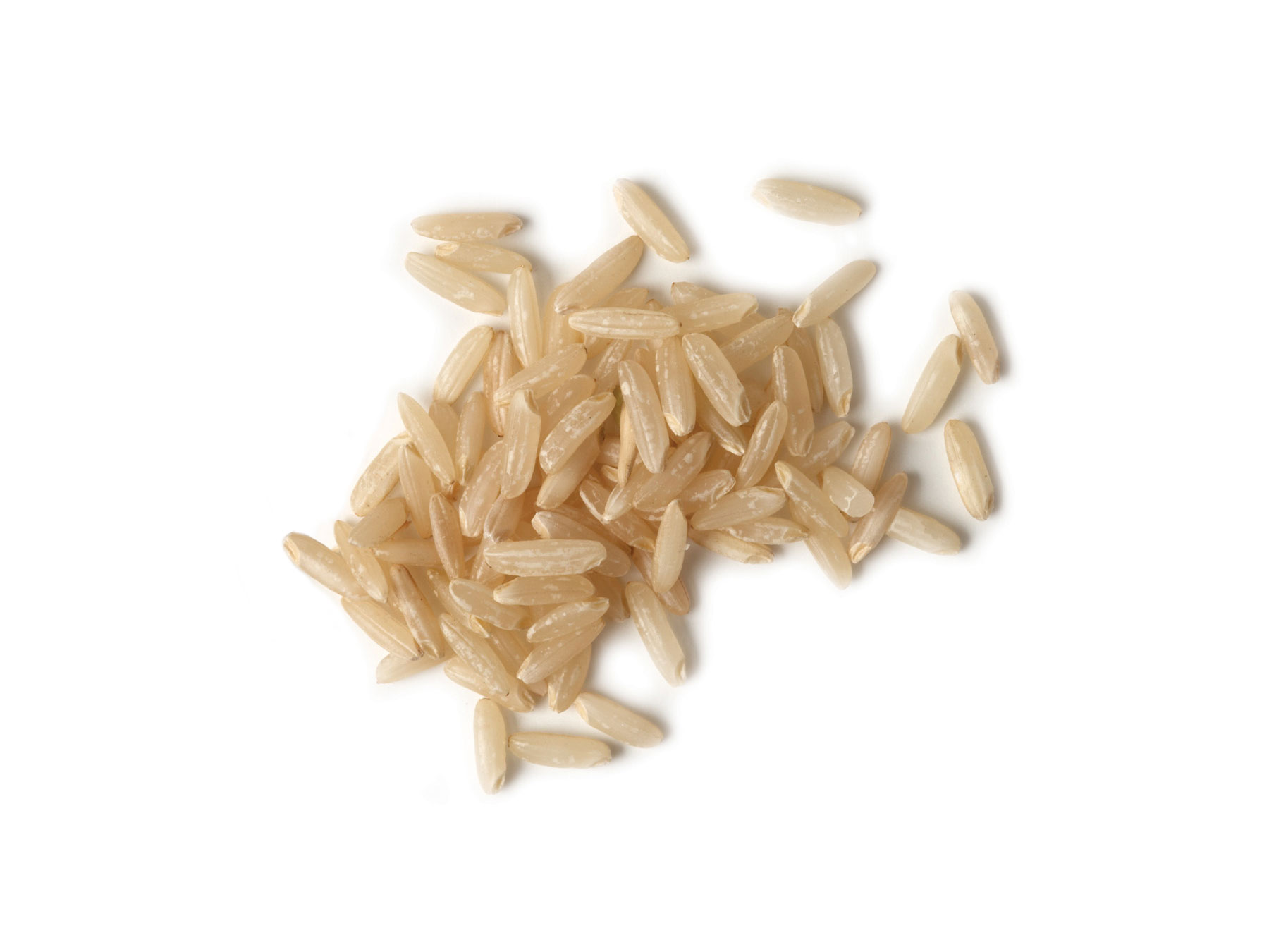 Overhead view of uncooked brownrice grains.