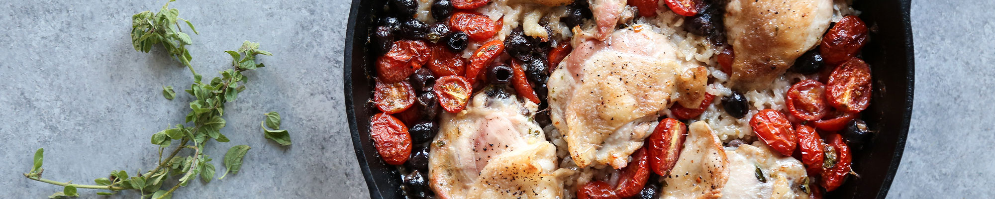 Overhead image of chicken rice casserole with tomatoes.