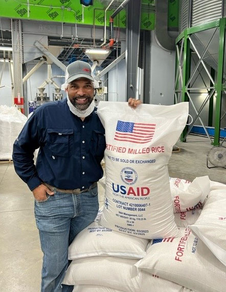 USA Rice Member Showcased At Black Professionals In Food And   Comm Pj Haynie Holds Fortified Rice Bag At Arkansas River Rice Mill Crop 230322 