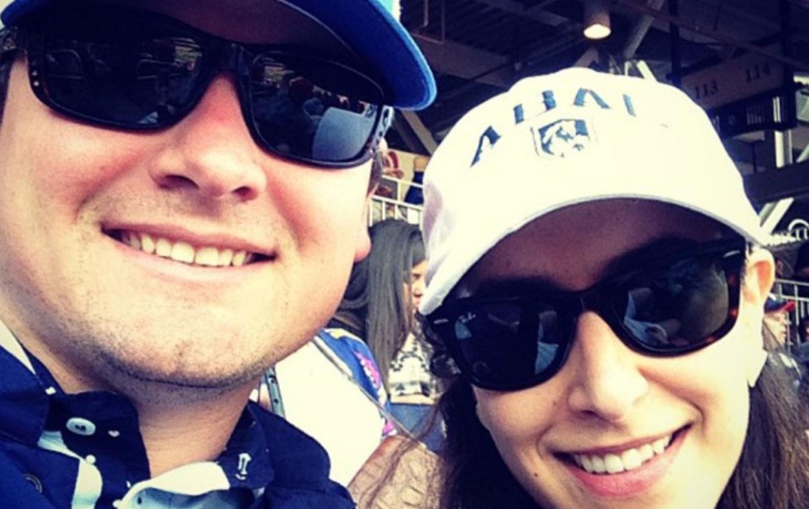 Closeup of man and woman wearing baseball caps and sunglasses