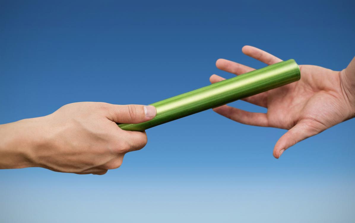 Hands passing-the-baton