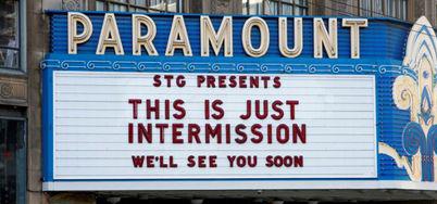 Theater marquee says "This Is Just Intermission, We