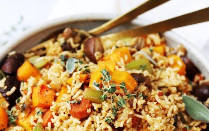 Bowl of brown rice, orange sweet potatoes & carrots, sage, thyme