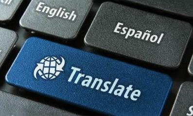 Blue "Translate" computer button surrounded by gray buttons displaying language choices: "English," "Espanol," "Francais," etc.