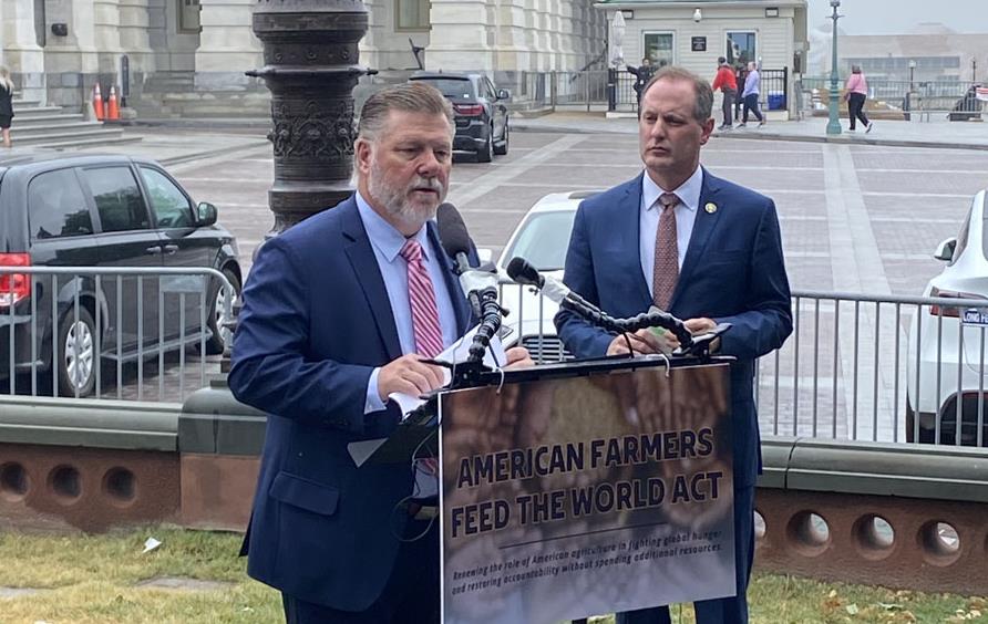 American Farmers Feed the World Act press conference, Rick Crawford stands at podium in front on US Capitol