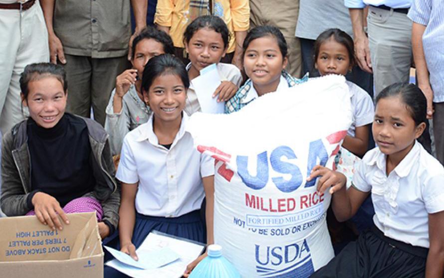 Children-with-sack-of-US milled-rice