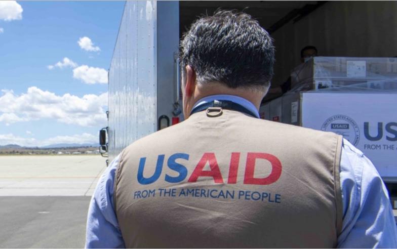 Man wearing USAID-vest