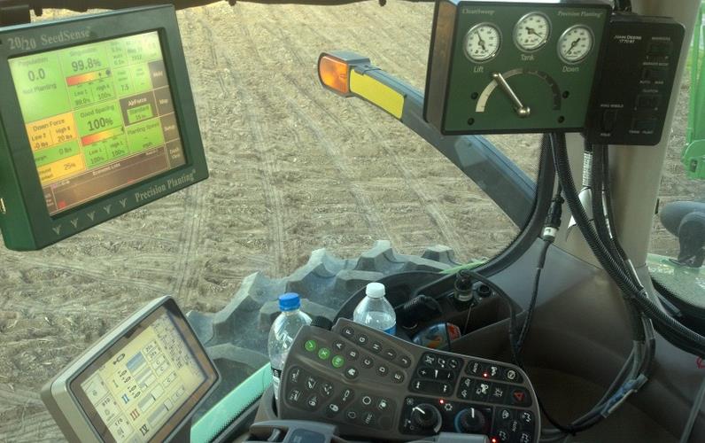 Multiple screens inside combine cab