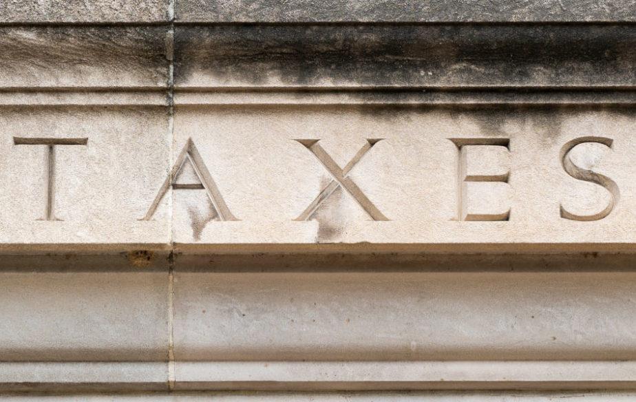 Taxes engraved on building fascade