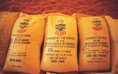 Stacks of USAID rice bags