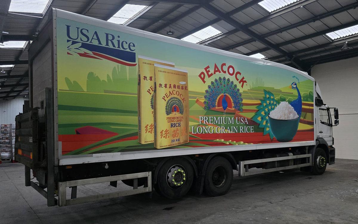 Bright, vibrant graphics, including USAR logo, on a DLS-Peacock-USA-Long-Grain 10-ton truck