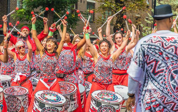 Drummers in colorful costumes at Notting-Hill-Carnival, replacement-photo