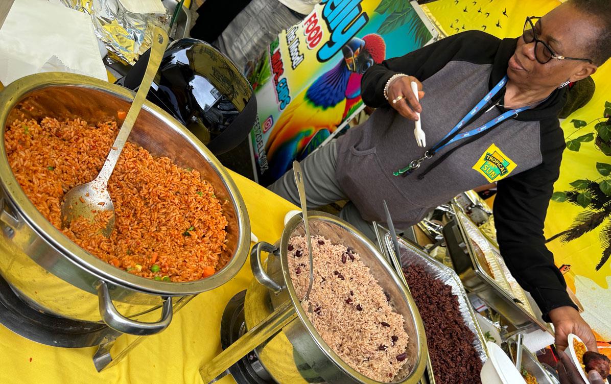 UK-Rice-Week,-Chef-Linda oversees the rice sampling station