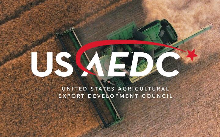 USAEDC logo with aerial view of combine at rice harvest