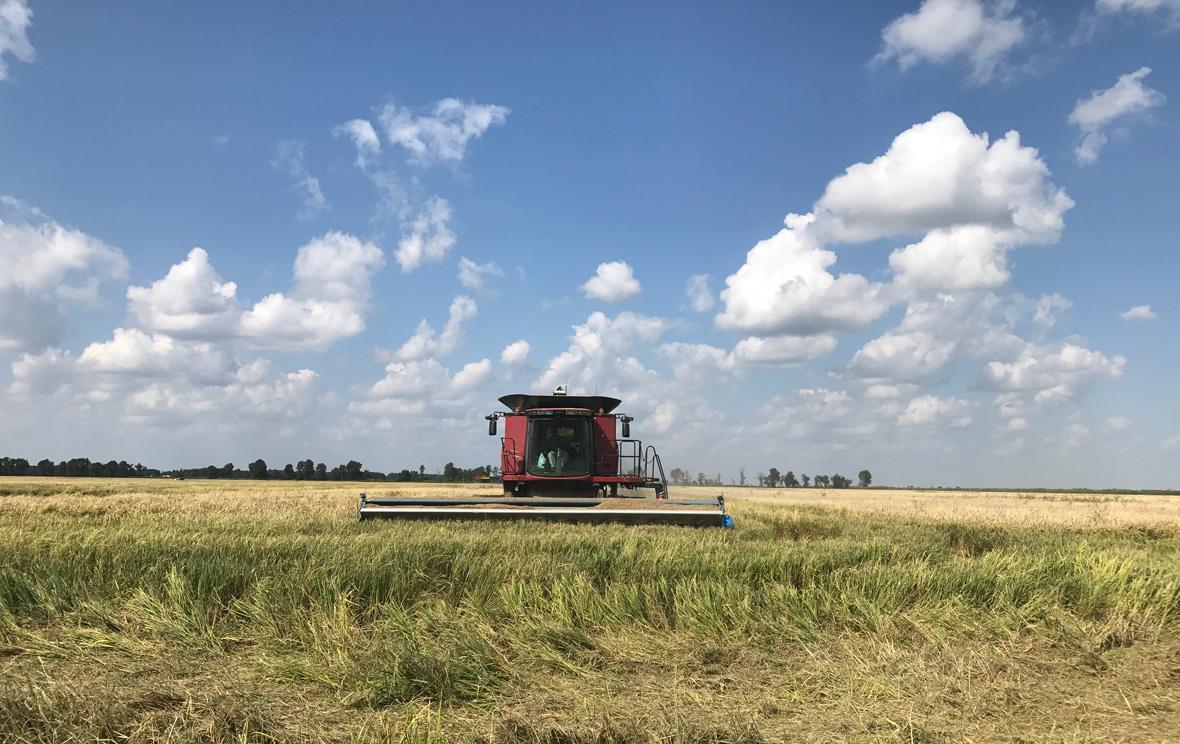 Red-combine-with-puffy-clouds