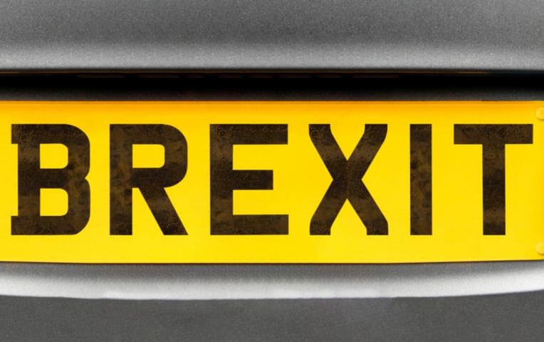 License plate that says BREXIT in black letters on yellow background 