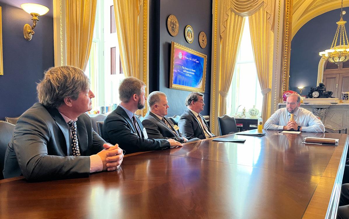 Nov-Fly-In,-MO-Rep-Jason-Smith meets with USAR members, seated around large conference room table