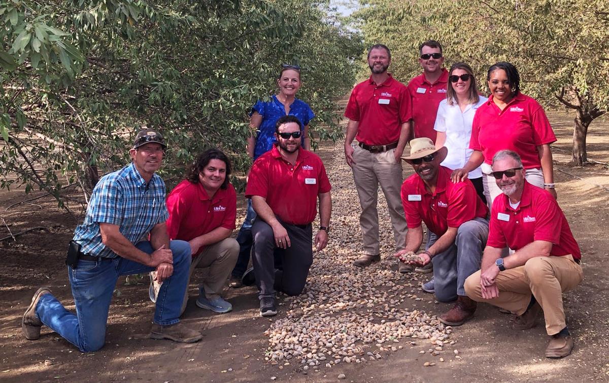 2023-25-Leadership-Class-at-Leo-LaGrande-Orchard, nuts in center of tree row