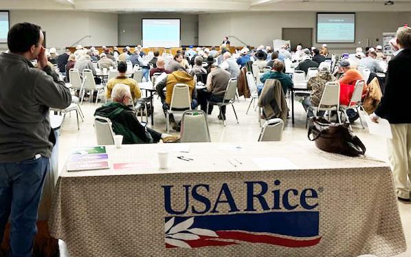 2025-Western-Rice-Belt-Conference,-crowd-shot with USA Rice table in foreground