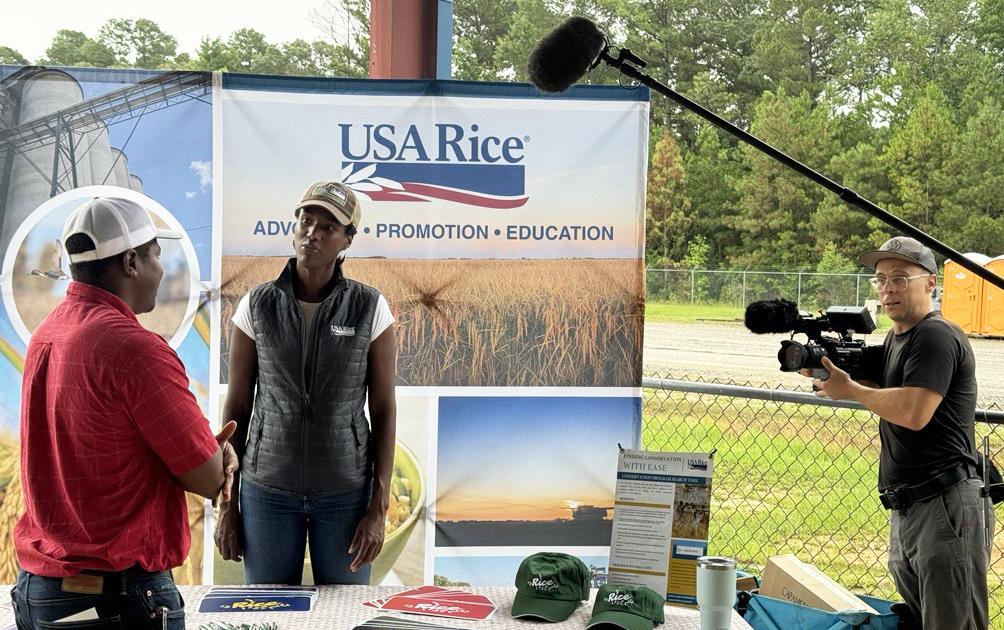 NBGC Field Day, A. Grigsby at booth with film crew