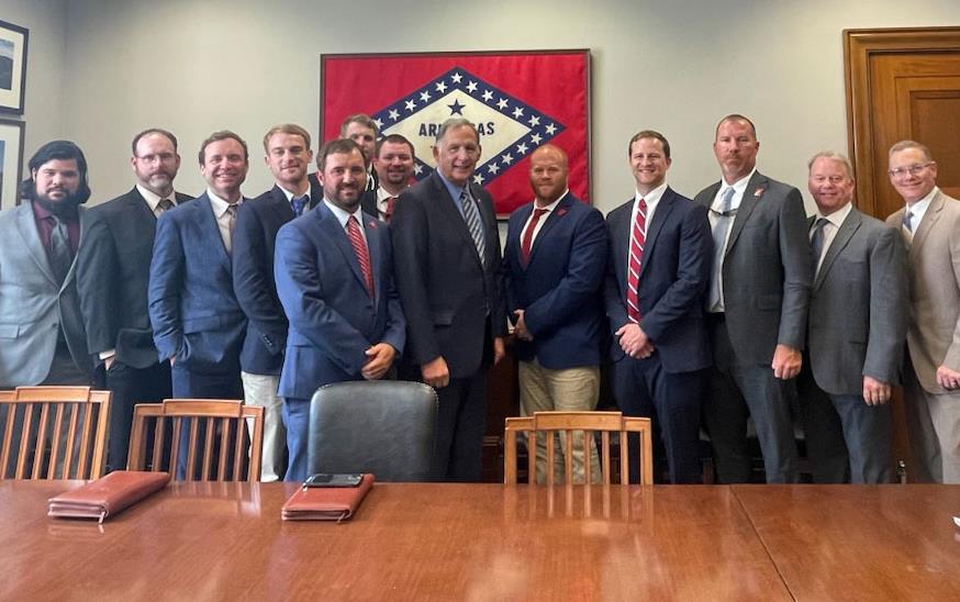 Riceland-Leadership-Program, group shot with Senator John-Boozman, Arkansas flag in background