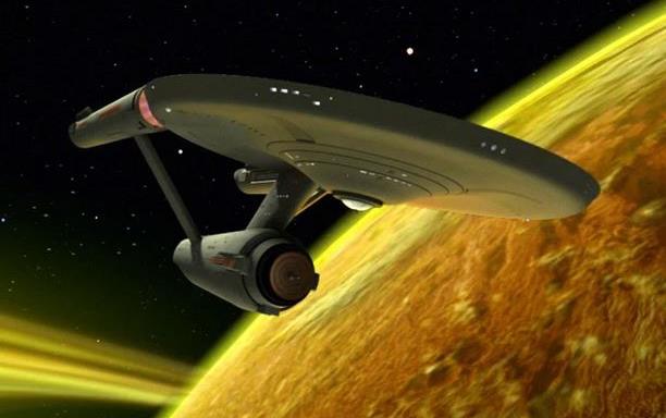 Starship Enterprise above yellow planet