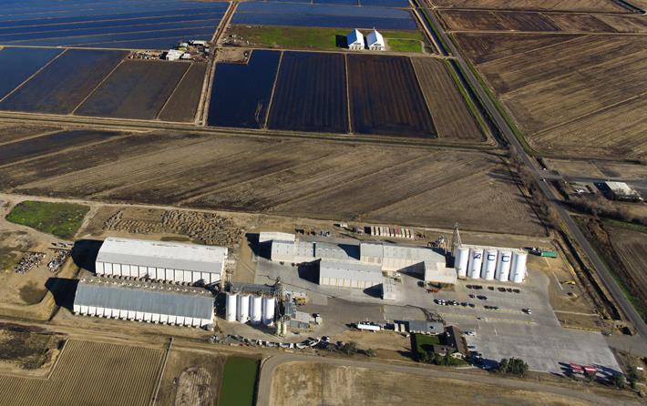 Aerial shot of ACC rice mill and surrounding flooded rice fields & Sutter Buttes