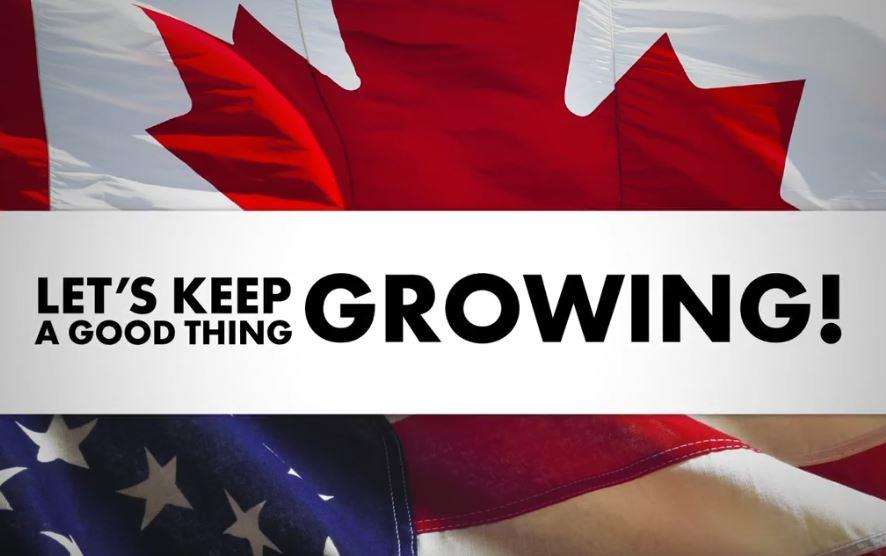 US & Canadian flags behind text: Let