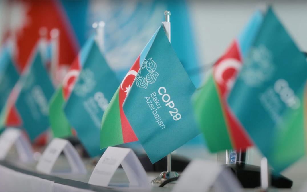 COP29-Climate-Summit,-close-up of pennants on table