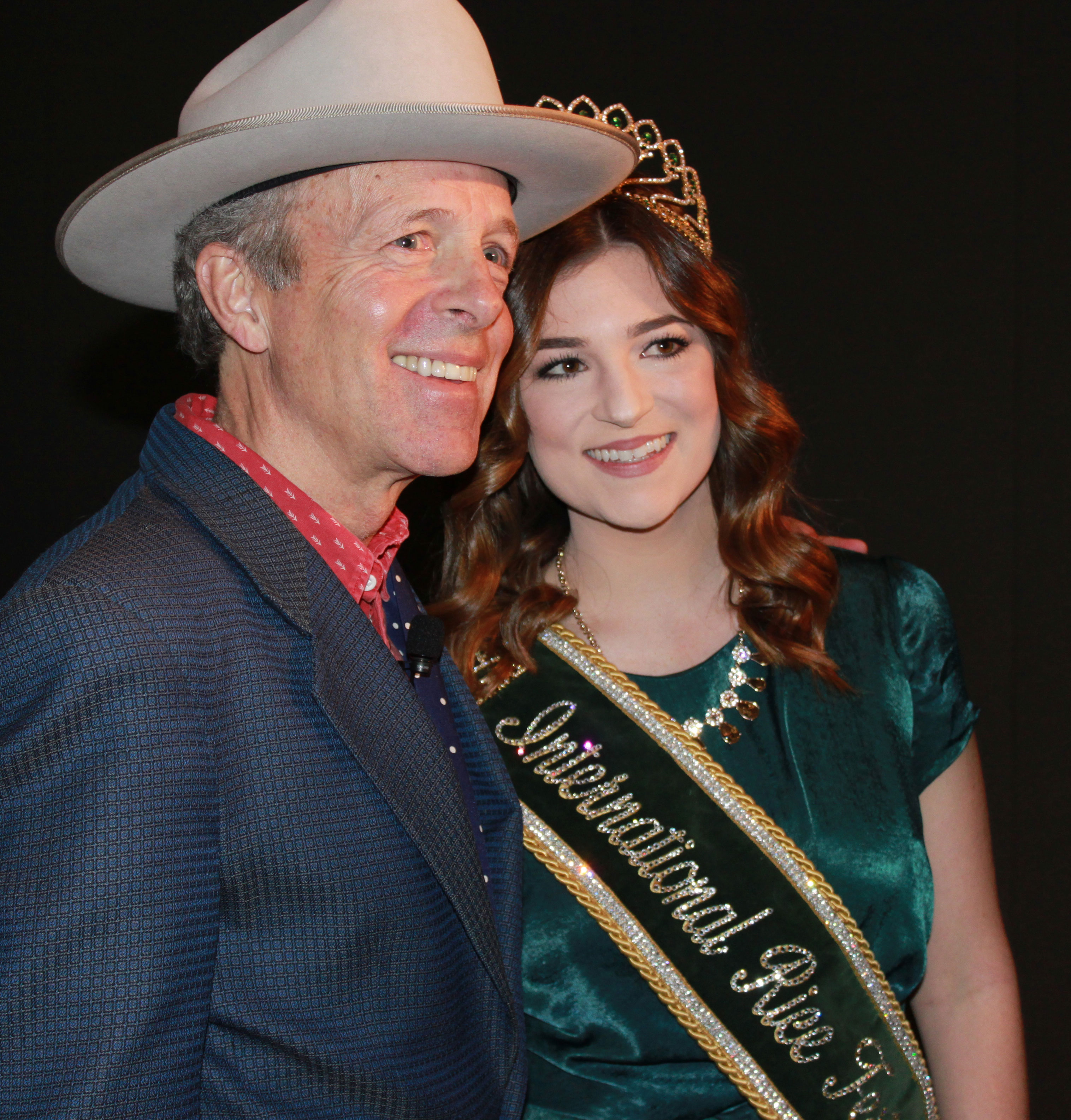 Mark McKinnon, wearing cowboy hat, and 2017 Rice Queen wearing tiara & sash