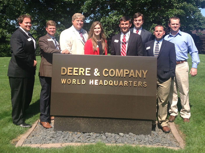 Leadership class group shot around Deere & Company World Headquarters sign