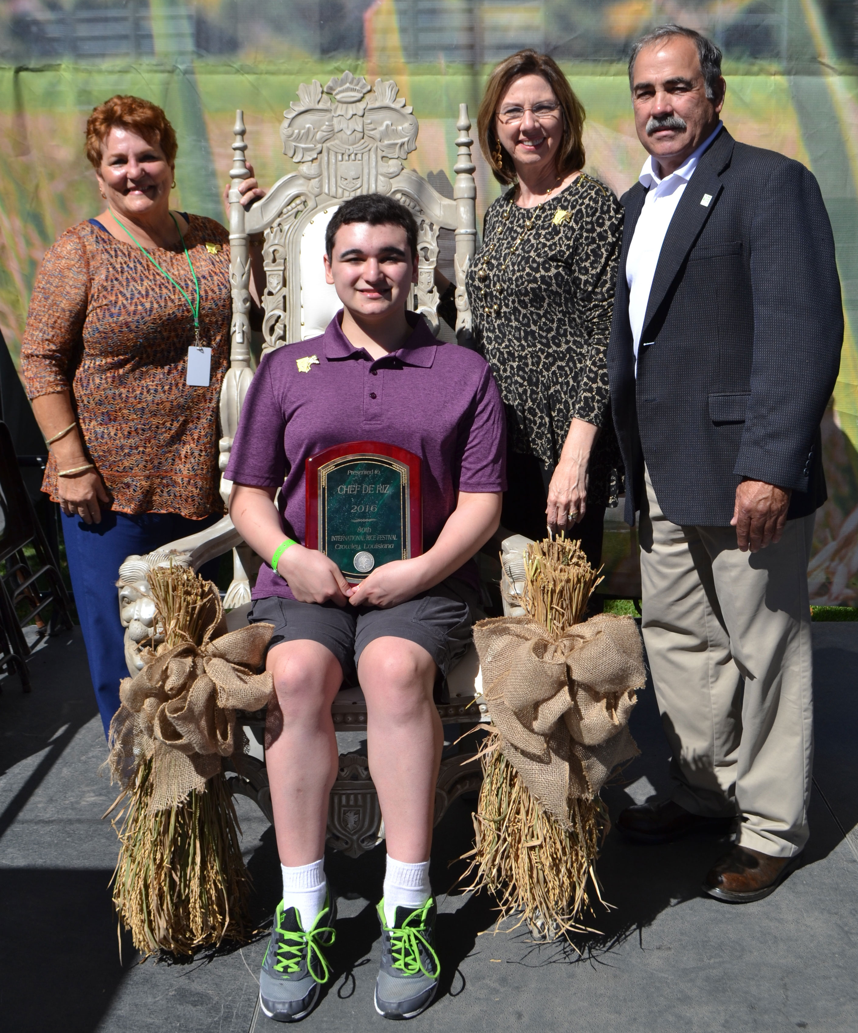 Chef-de-Riz-Joshua-Dietz seated on throne surrounded by rice plants