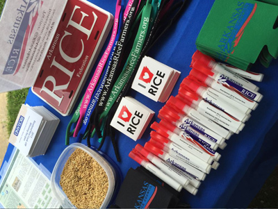 Rice pens, stickers, license plates and coozies on display